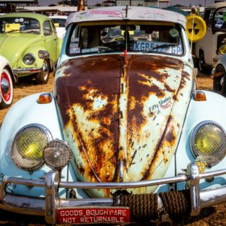 white volkswagen beetle coupe parked